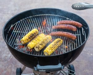 cooking corn and sausage on a weber kettle grill